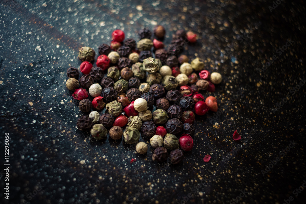 Colored pepper on a black background Colored pepper on a black background