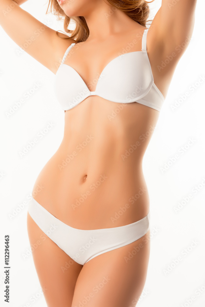 Clouse up photo of perfect female body isolated on white backgro Clouse up photo of perfect female body isolated on white backgro