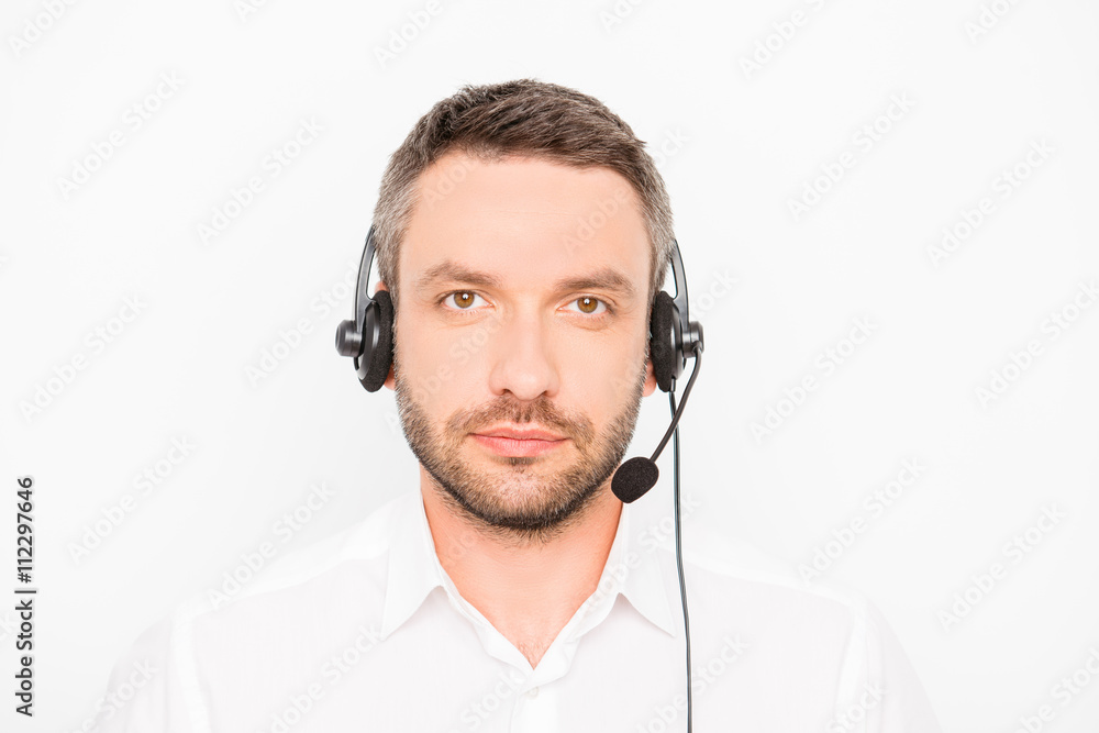 Portrait of bearded young worker of call center Portrait of bearded young worker of call center