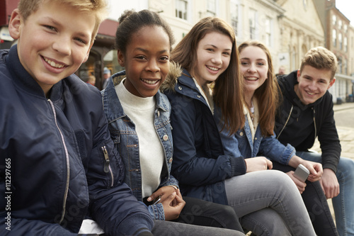 Portrait Of Teenage Friends Hanging Out In City Centre