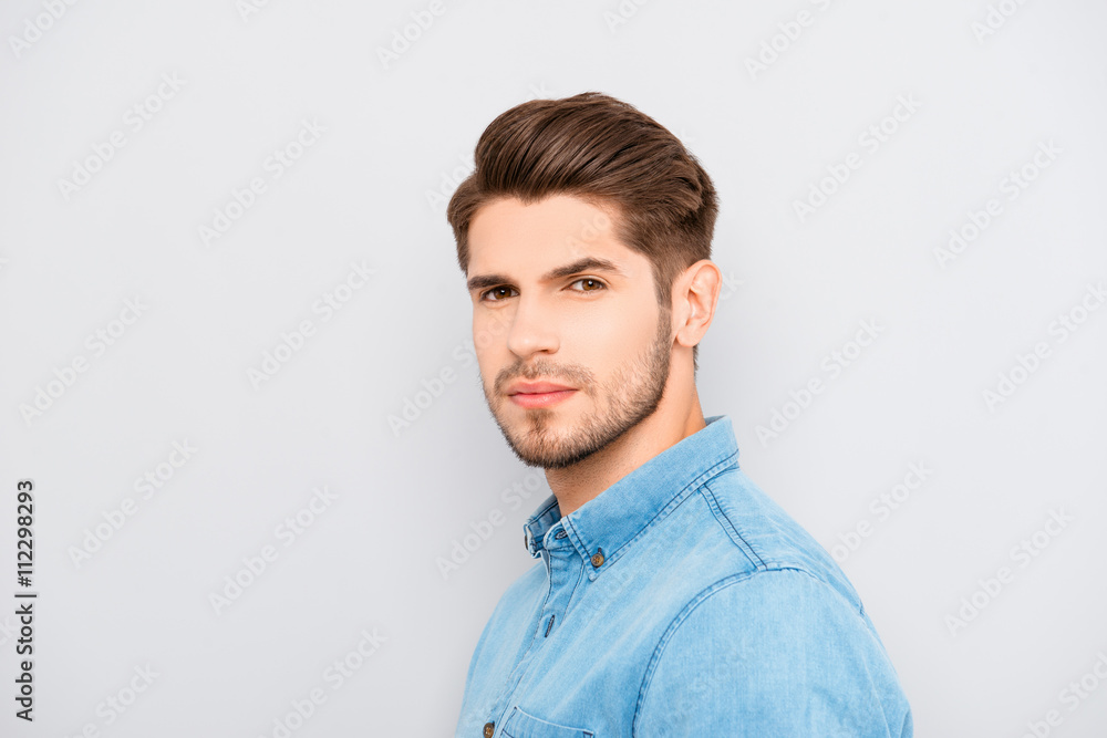 Portrait of serious young man with bristle on gray background Portrait of serious young man with bristle on gray background