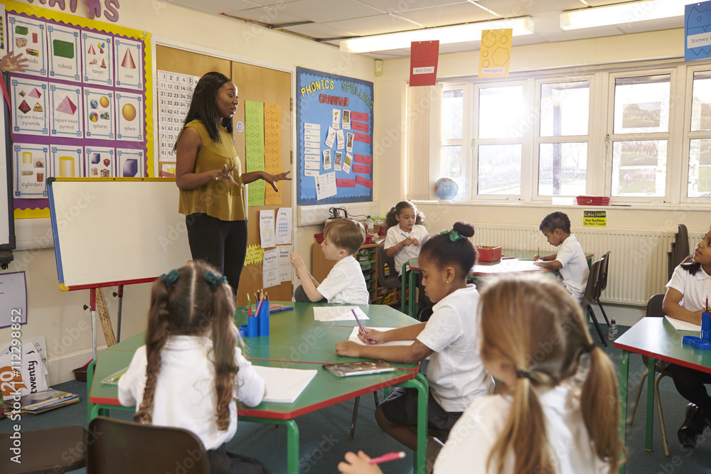 © Guerilla - Pupils Working At Desks In Elementary School Classroom © Guerilla - Pupils Working At Desks In Elementary School Classroom