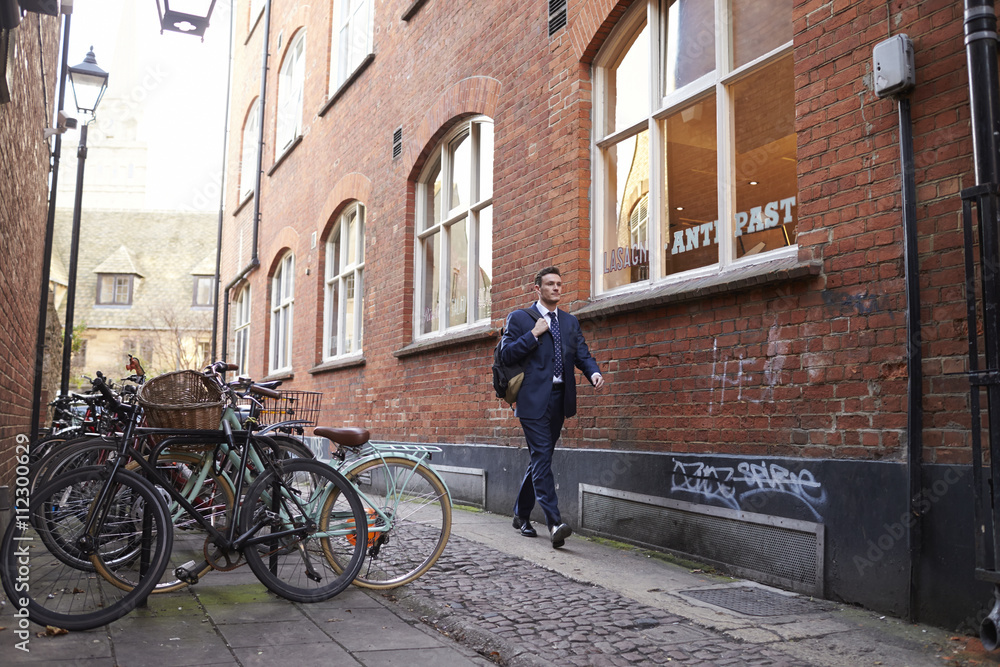 Businessman Walking To Work In Urban Environment Businessman Walking To Work In Urban Environment