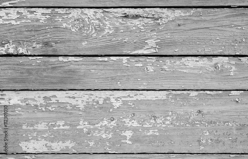 Weathered wooden planks in a row with enamel.