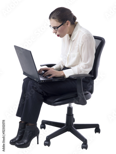 surprised businesswoman looking at her laptop
