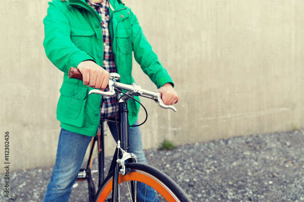 Obraz premium close up of man with fixed gear bike on street