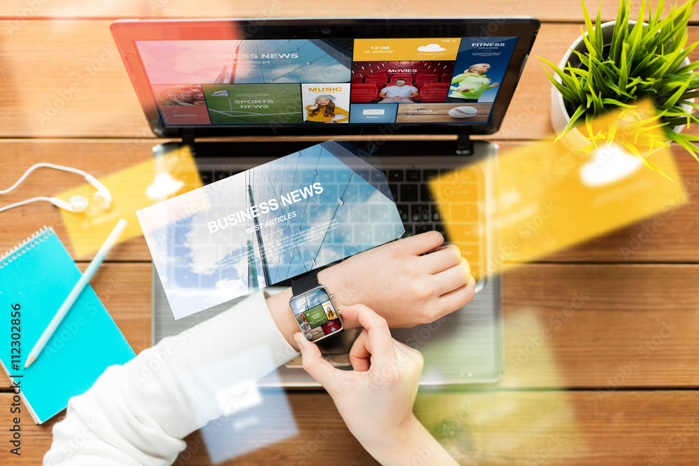Fototapeta premium close up of woman with smart watch and laptop