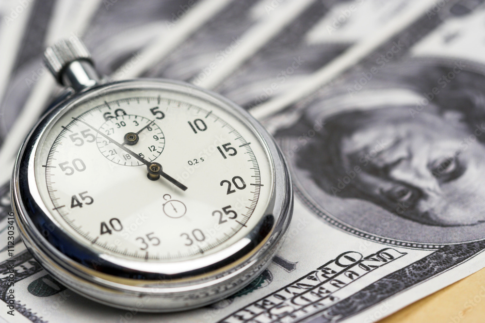 Chronometer and dollar bills Chronometer and dollar bills