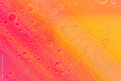 Beautiful soft oil mixed with water on colorful gradient background