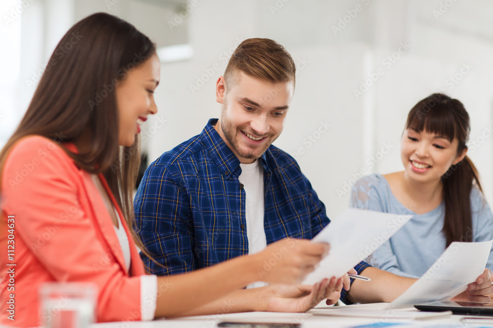 happy creative team or students working at office happy creative team or students working at office