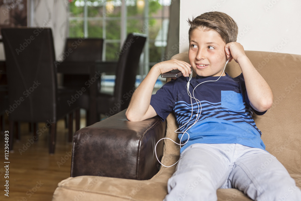 Obraz premium Child sit on sofa at home