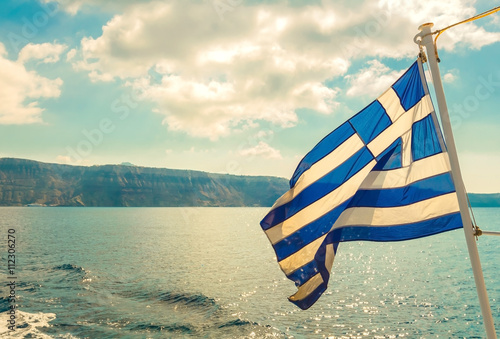Vintage image of Greek flag and back light, Mediterranean sea, Greece
