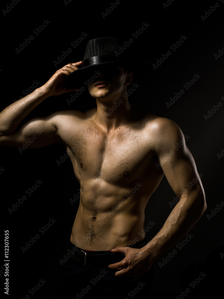 Sexy muscular man in hat Sexy muscular man in hat