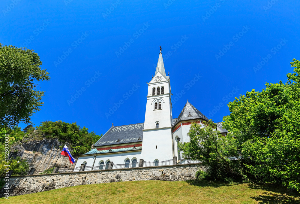 Public Neo Gothic Parish Church of Saint Martin at Bled lake in Slovenia on sunny day Public Neo Gothic Parish Church of Saint Martin at Bled lake in Slovenia on sunny day