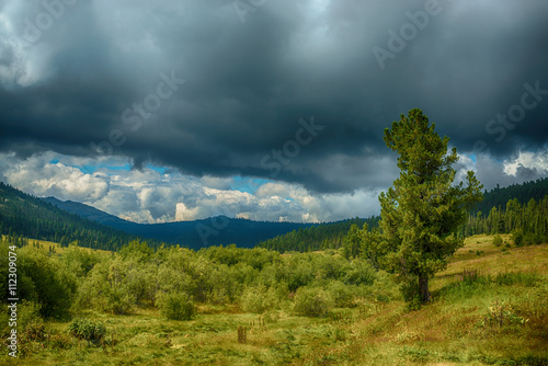 Beautiful mountain landscape at cloudy summer day 