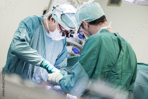 Heart surgeons during a heart valve operation photo