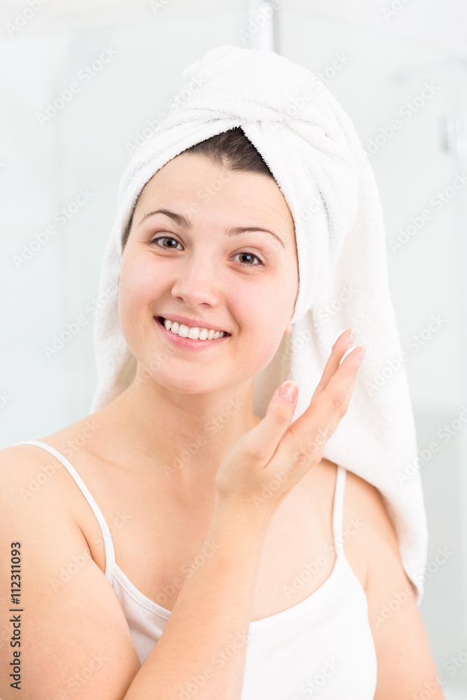 Applying face cream Applying face cream