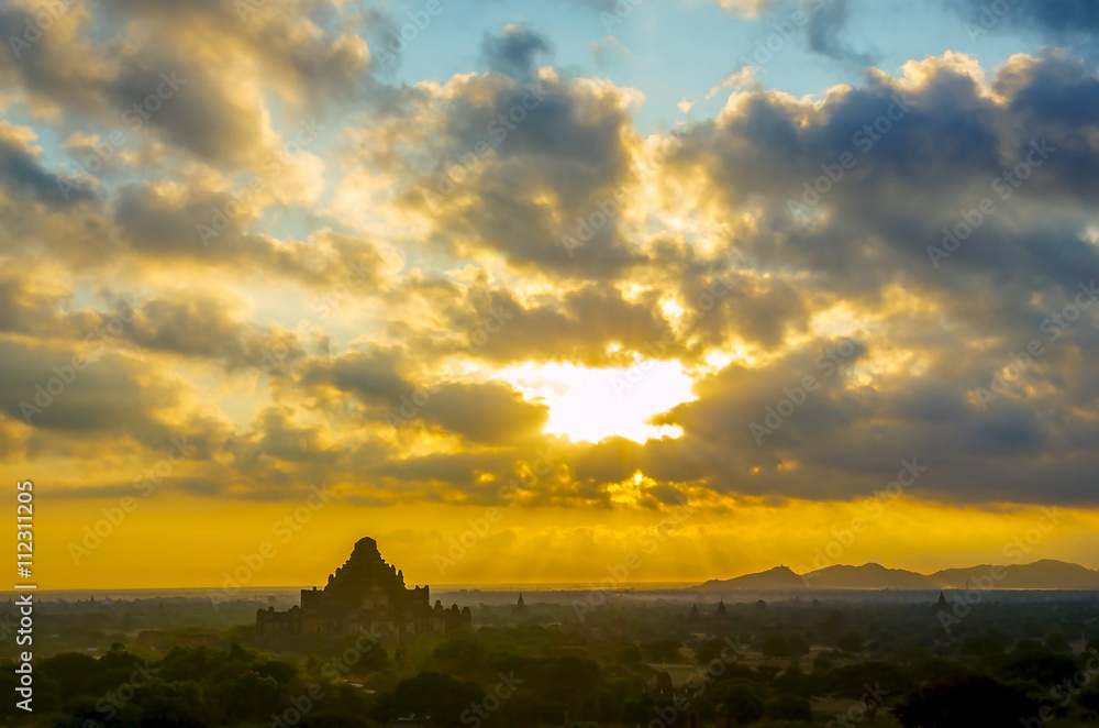 Scenic sunrise above Bagan in early morning, Myanmar. Bagan is an ancient city with thousands of historic buddhist temples and stupas.
