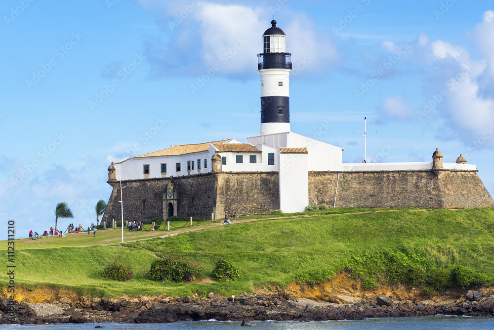 View of Farol da Barra Lighthouse in Salvador da Bahia, Brazil. Dating from the year 1698, it is said to be the oldest lighthouse in South America.