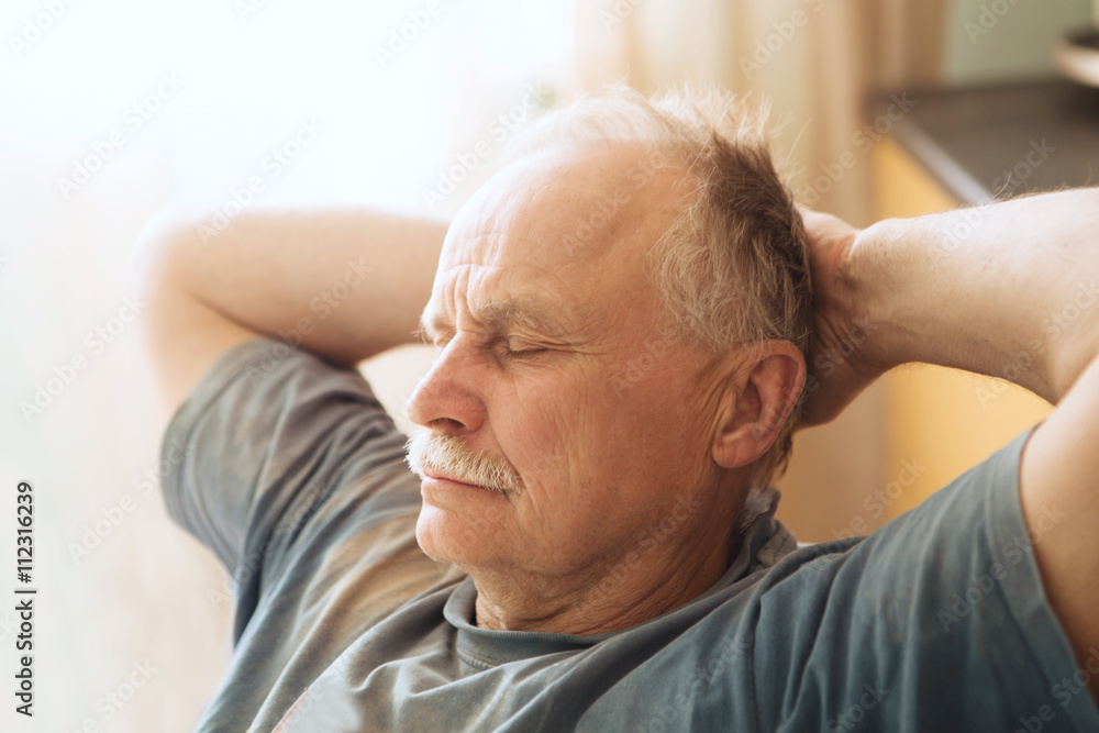 portrait of the tired elderly man sleeping at a table
portrait of the tired elderly man sleeping at a table