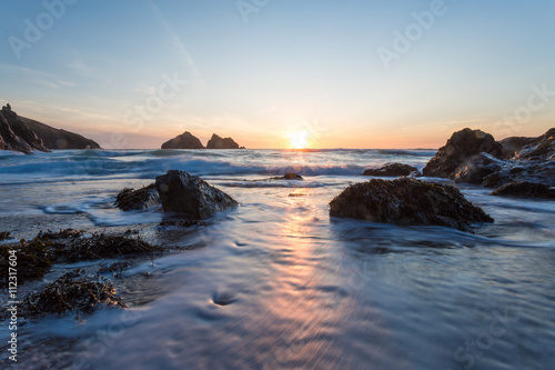 Holywell bay at sunset in cornwall england uk
