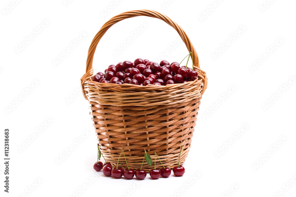 Basket full of fresh red cherry on a white background Basket full of fresh red cherry on a white background