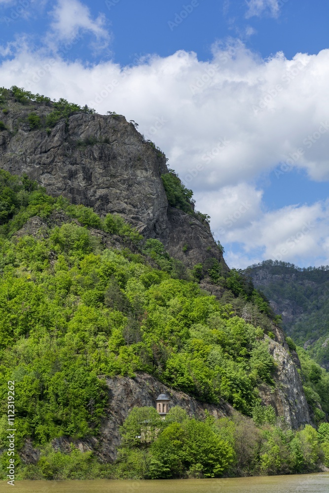 Landscape with Olt river and Cozia Mountains in background Landscape with Olt river and Cozia Mountains in background