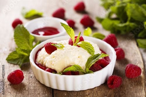 Light dessert with champagne and raspberry sauce