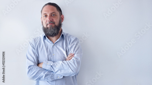 Portrait of older man with beard that is going grey