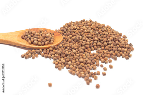 Coriander seeds with spoon isolated on white