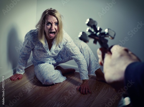 Fototapeta Casting out a demon from a woman through prayer.