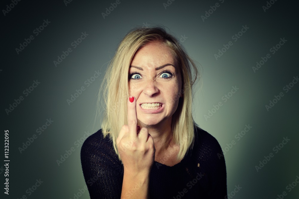Woman shows sign of fuck off.