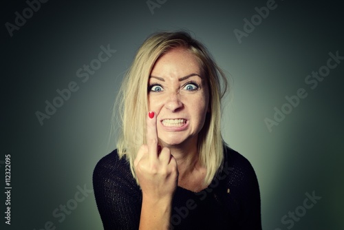Obraz na płótnie Woman shows sign of fuck off. w salonie