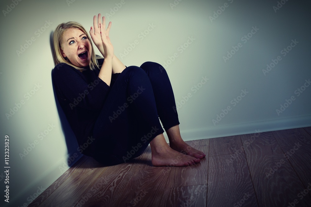 Scared woman. Afraid and screaming.