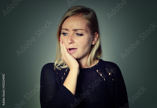 Obraz na płótnie Woman with a toothache. w salonie