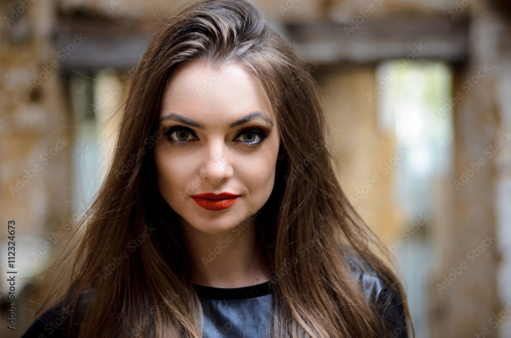 Fototapeta premium portrait of model posing outdoors in black leather clothes