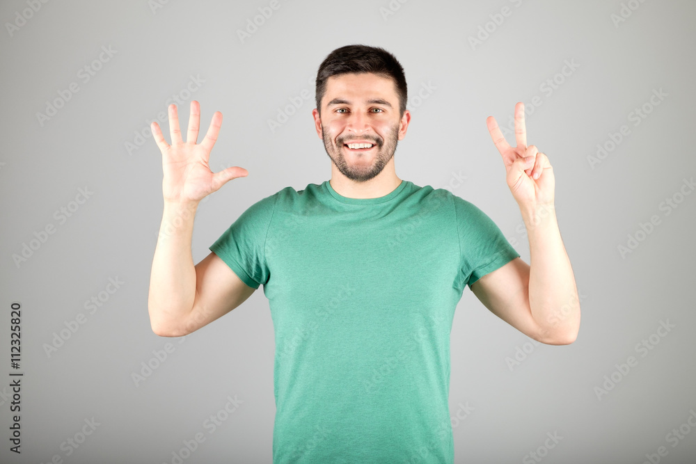 Man showing number by fingers Man showing number by fingers
