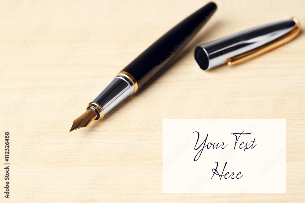 Fountain pen on wooden table background Fountain pen on wooden table background