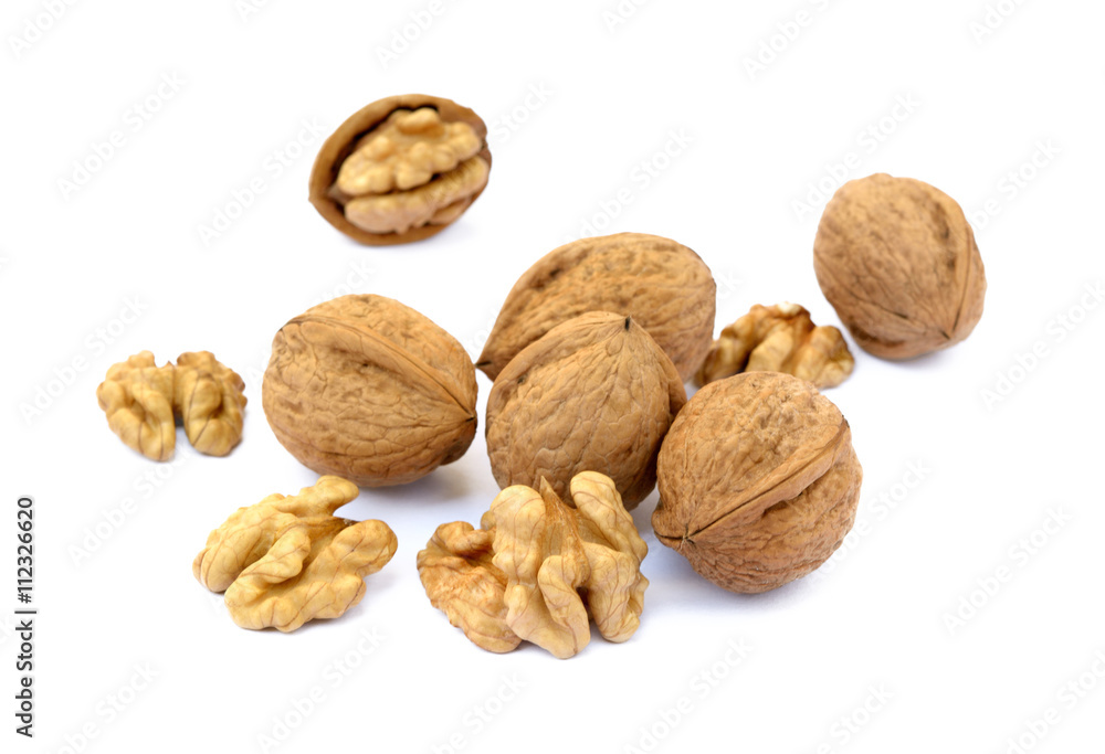 Fresh walnuts with a shell isolated on white background Fresh walnuts with a shell isolated on white background