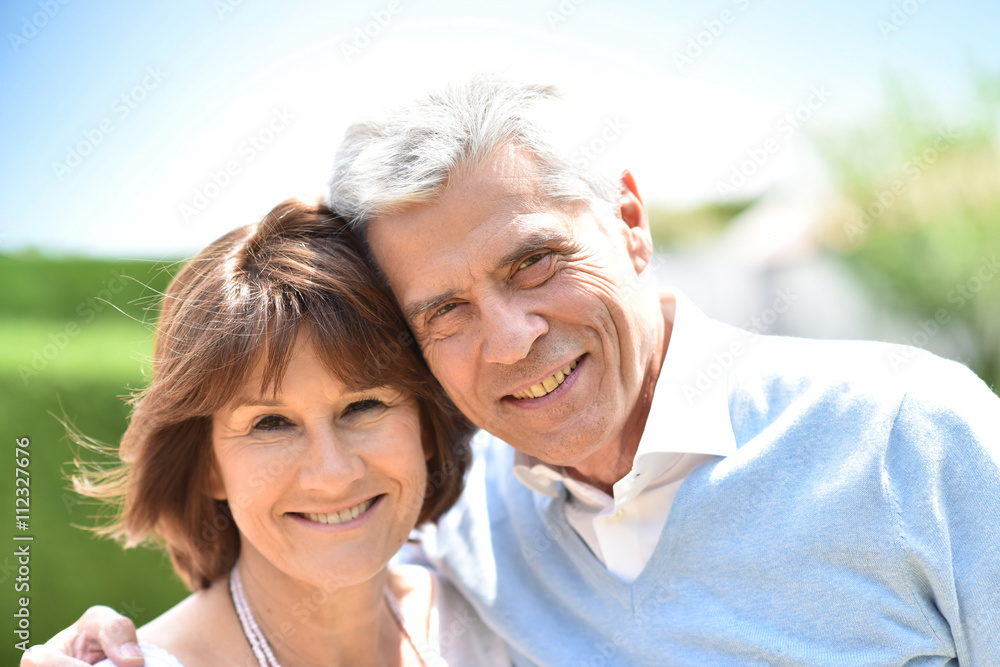 Senior couple embracing each other outside Senior couple embracing each other outside