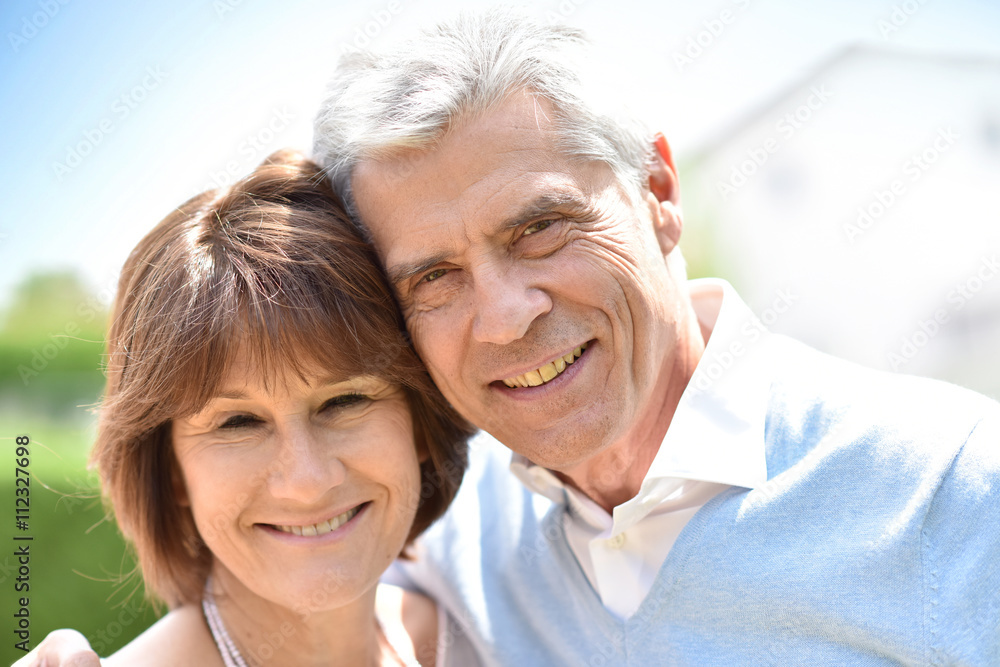 Senior couple embracing each other outside Senior couple embracing each other outside