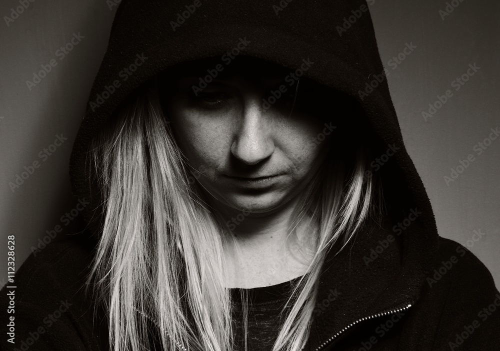 Rebellious teenager in a hoodie.