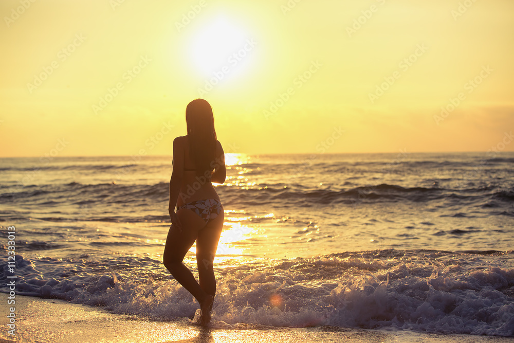Silhouette of carefree woman on the beach Silhouette of carefree woman on the beach