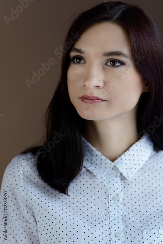 Portrait of young brunette woman