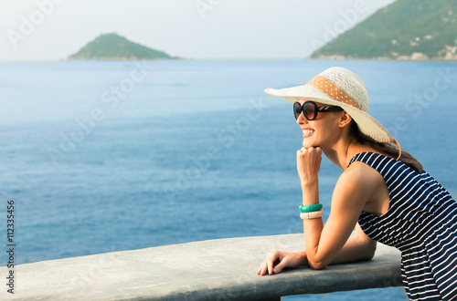 Attractive woman watching the sunset. People enjoying nature. 