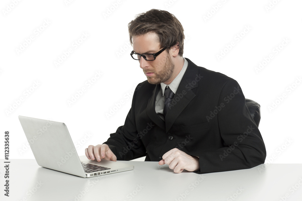 a busy businessman using a laptop a busy businessman using a laptop