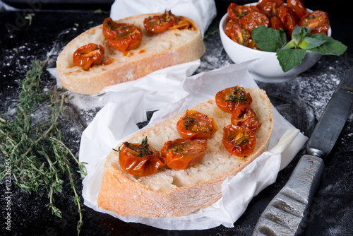 Traditional Italian bread ciabatta with dried tomatoes
 photo