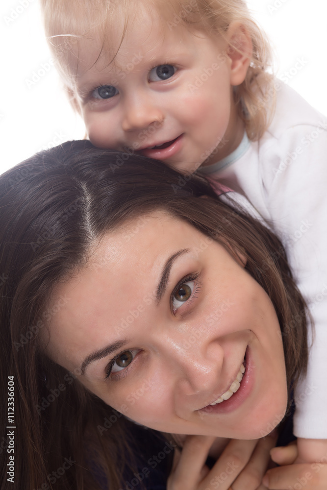 Smiling young mother and her happy child Smiling young mother and her happy child
