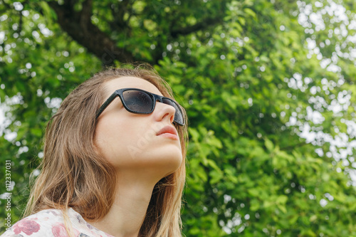 girl in sunglasses rain looking at the sky © nastenka_peka