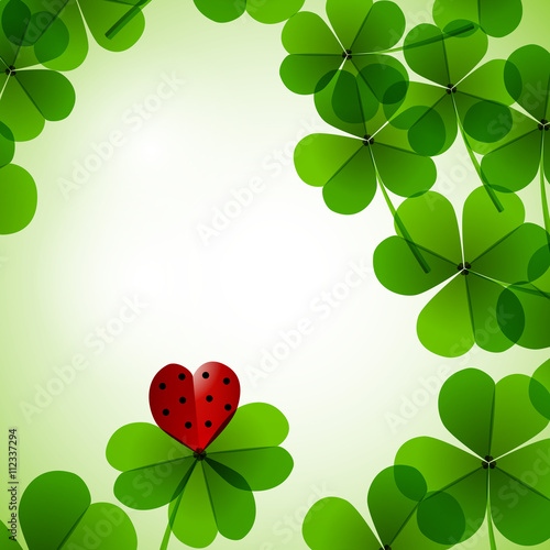 Fresh leafs clover with heart on a tender blurred background